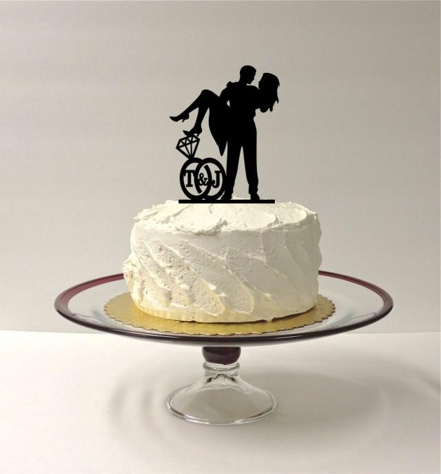 personalized-cute-wedding-cake-topper-with-your-initials-of-the-bride-groom-in-a-wedding-ring-design-silhouette-cake-topper